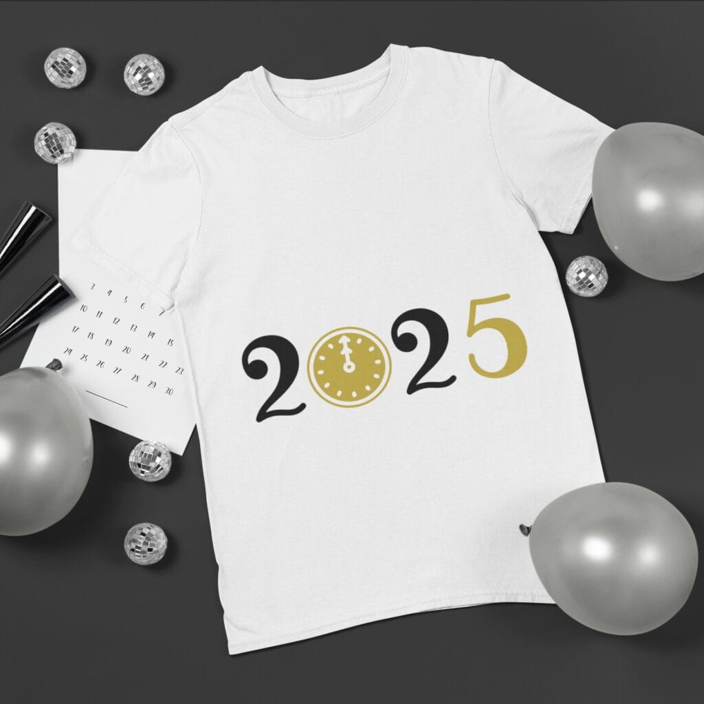 A white t-shirt featuring a '2025' New Year's design with a gold clock replacing the '0', styled with silver balloons and a festive backdrop.