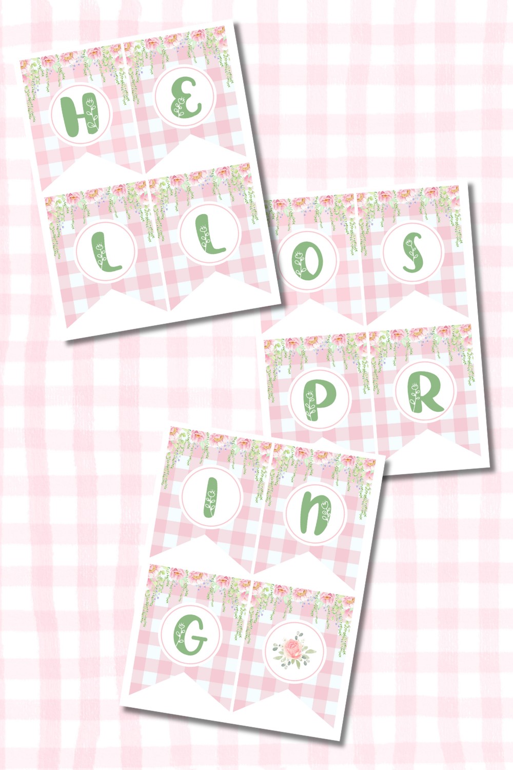 A preview of a free printable 'Hello Spring' banner with three separate sheets displaying pastel pink and green lettered pennants. The background features soft pink buffalo plaid, floral accents, and cascading greenery.