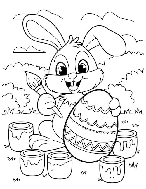 bunny painting a large Easter egg with colorful paints.